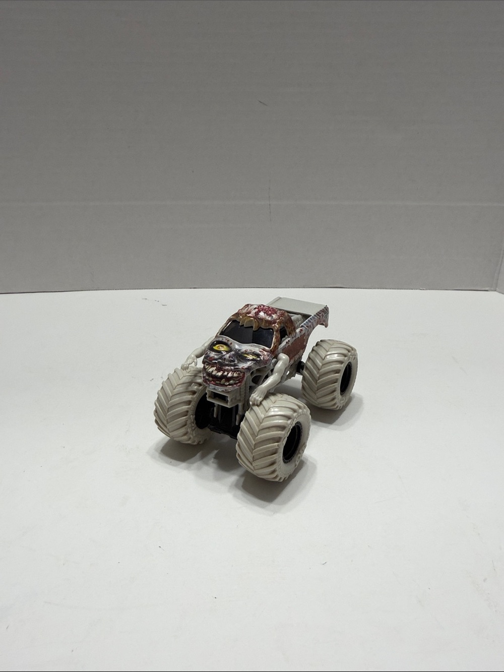 Monster Jam Zombie Truck Toy in Brown with White Wheels